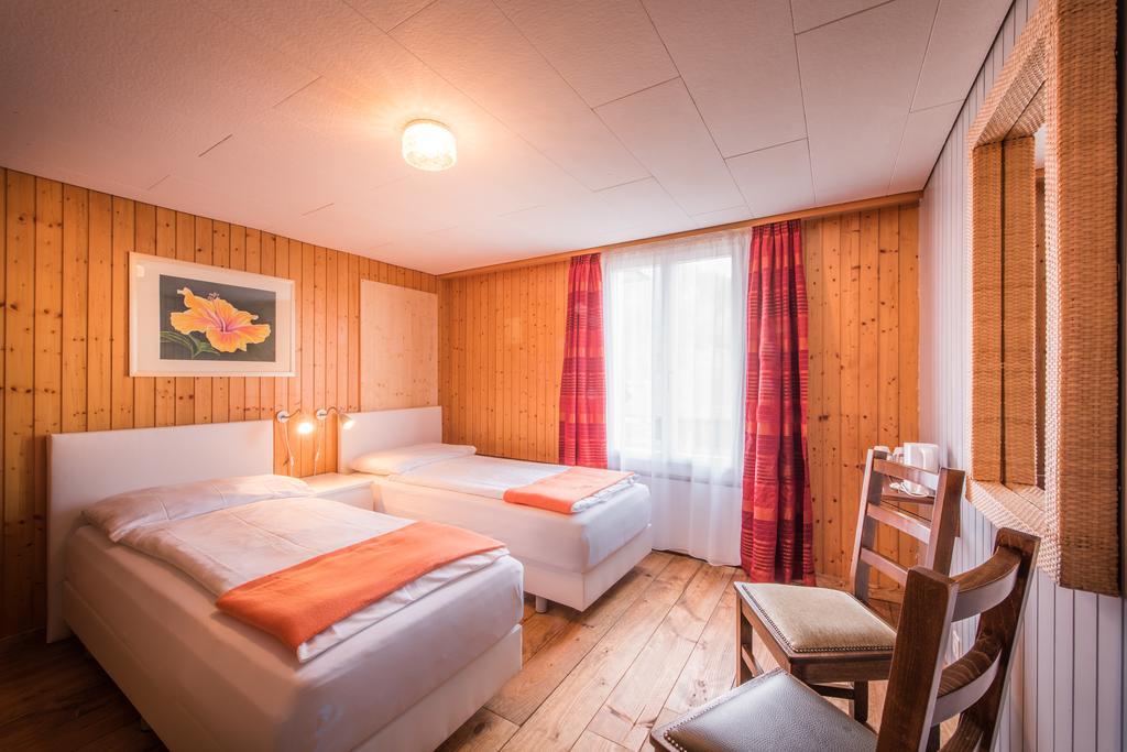 Hotel Tell And Apartments Unterseen Room photo